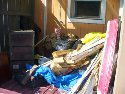 Patio with Junk Before Waste Removal
