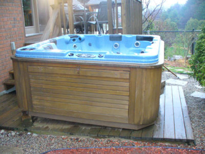 Patio Deck with Hot Tub Before Junk Removal